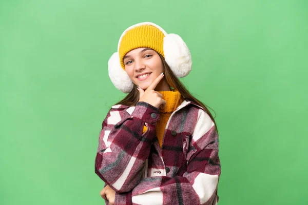 Adolescente Caucásico Chica Usando Invierno Muffs Sobre Aislado Fondo Sonriendo —  Fotos de Stock