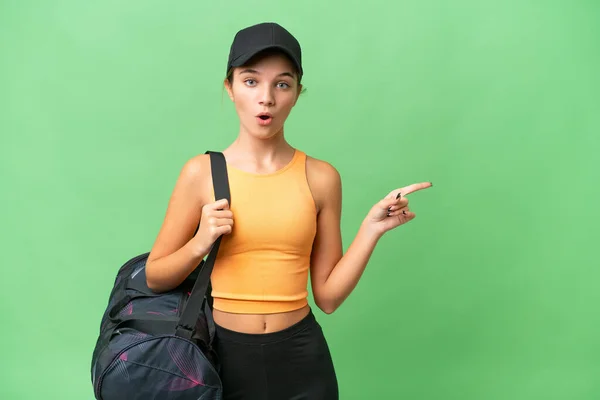 Teenager Caucasian Girl Sport Bag Isolated Background Surprised Pointing Side — Stock Photo, Image