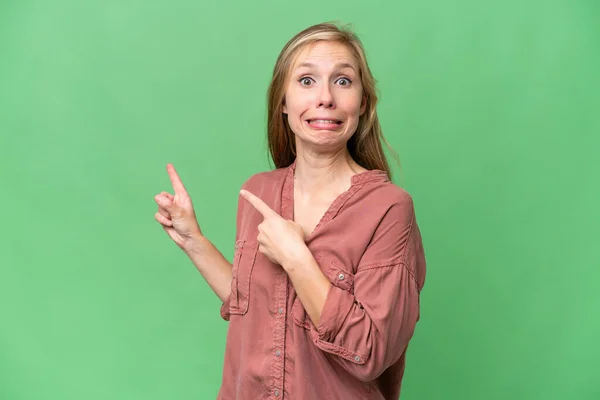 Young Blonde Woman Isolated Background Frightened Pointing Side — Stock Photo, Image