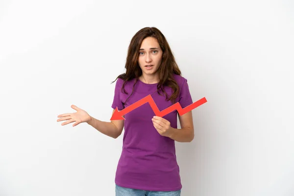 Young Caucasian Woman Isolated White Background Holding Downward Arrow Sad — Stock Photo, Image