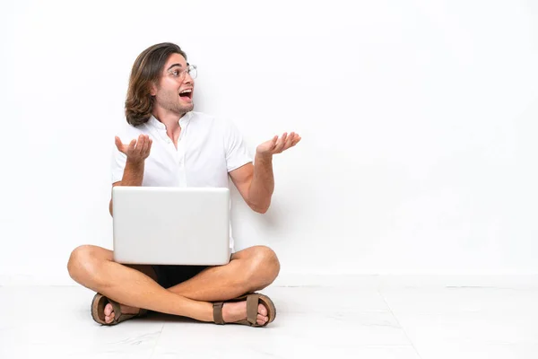 Young Handsome Man Laptop Sitting Floor Isolated White Background Surprise — Foto de Stock