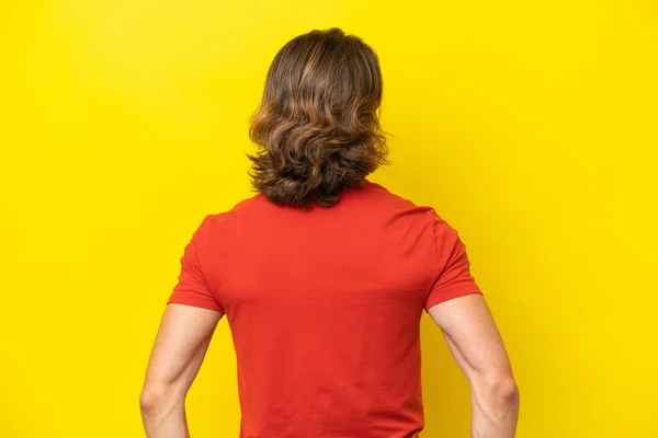 Caucasian Handsome Man Isolated Yellow Background Back Position — Stock Photo, Image