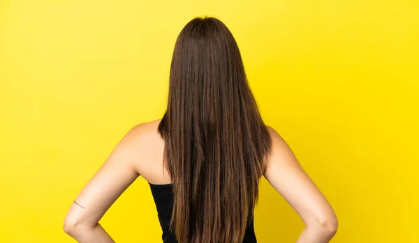 Young Brazilian Woman Isolated Yellow Background Back Position — Stock Photo, Image
