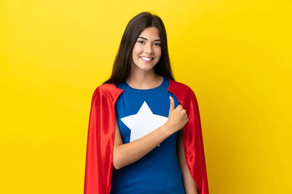 stock image Super Hero Brazilian woman isolated on yellow background giving a thumbs up gesture
