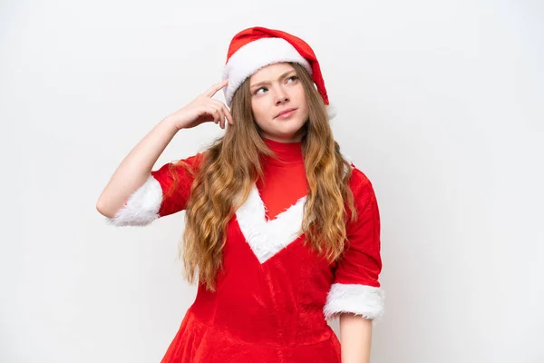 年轻的高加索女人 穿着白色背景的圣诞礼服 有着疑惑和困惑的面部表情 — 图库照片