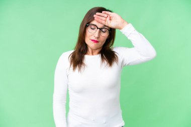 Middle age woman over isolated chroma key background with tired and sick expression