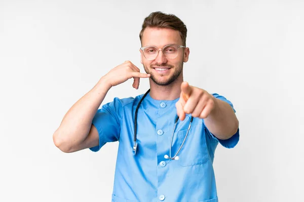 Young Nurse Man Isolated White Background Making Phone Gesture Pointing — Stock Photo, Image
