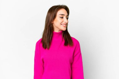 Young caucasian woman over isolated white background looking side