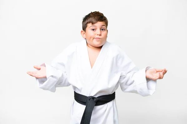 Malý Kavkazský Kluk Dělá Karate Nad Izolovaným Bílým Pozadím Pochybnostmi — Stock fotografie