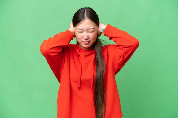 Young Asian woman over isolated background covering eyes by hands. Do not want to see something