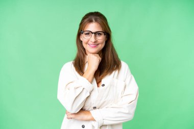 Middle age woman over isolated background with glasses and smiling