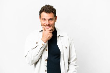 Brazilian man over isolated white background thinking