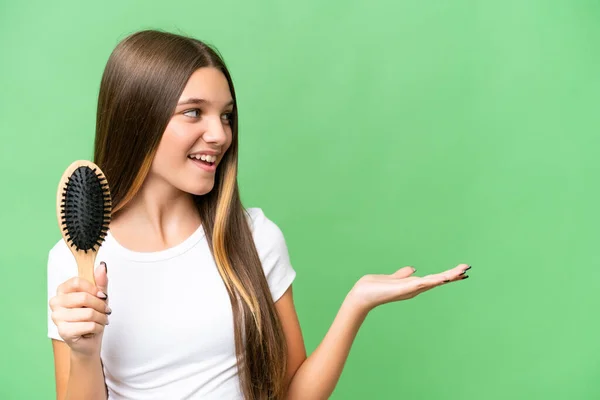 Teenager caucasian girl with hair comb over isolated background with surprise facial expression