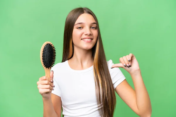 Teenager caucasian girl with hair comb over isolated background proud and self-satisfied