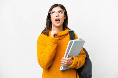 Young student woman over isolated white background thinking an idea pointing the finger up