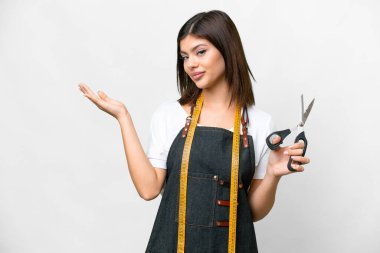 Seamstress woman over isolated white background extending hands to the side for inviting to come