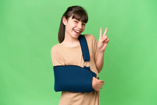 Little Caucasian Girl Broken Arm Wearing Sling Isolated Background Smiling — Foto de Stock