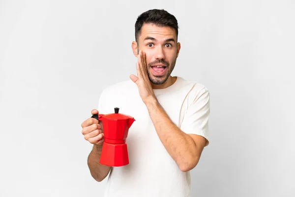 Jonge Blanke Man Met Koffiepot Geïsoleerde Witte Achtergrond Fluisterend Iets — Stockfoto
