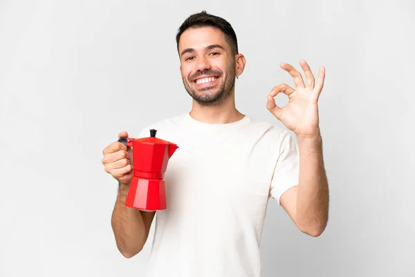 Jonge Blanke Man Houdt Koffie Pot Geïsoleerde Witte Achtergrond Tonen — Stockfoto