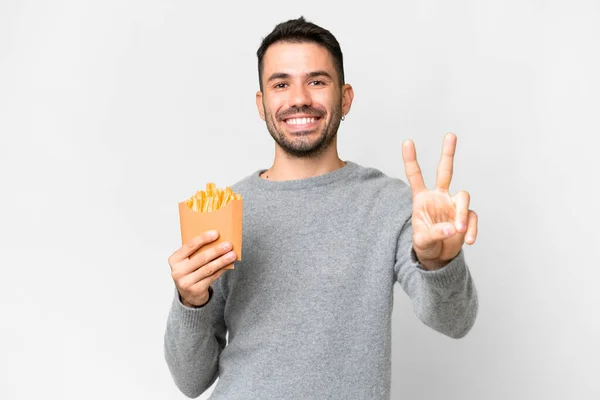 Jonge Blanke Man Met Gebakken Chips Geïsoleerde Witte Achtergrond Glimlachend — Stockfoto