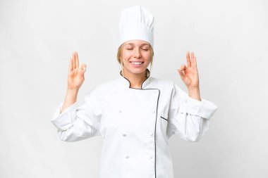 Young chef woman over isolated white background in zen pose