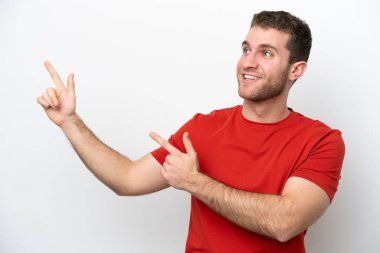 Young caucasian man isolated on white background pointing with the index finger a great idea