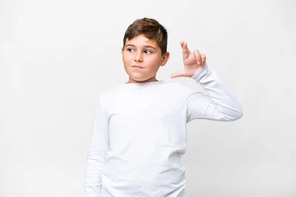 stock image Little caucasian kid over isolated white background with fingers crossing and wishing the best