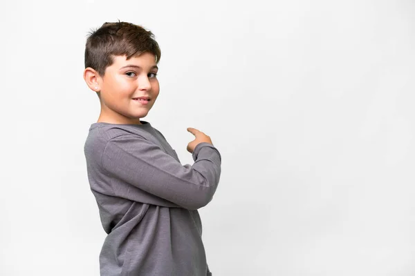 Petit Enfant Caucasien Sur Fond Blanc Isolé Pointant Vers Arrière — Photo