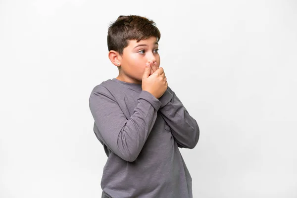 Little Caucasian Kid Isolated White Background Covering Mouth Looking Side — Stock Photo, Image