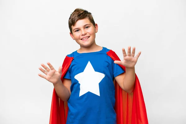 Stock image Super Hero caucasian kid over isolated white background counting ten with fingers