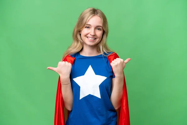 Super Hero English woman over isolated background with thumbs up gesture and smiling