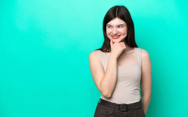 Young Russian Woman Isolated Green Background Looking Side Smiling — Foto de Stock