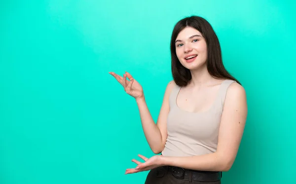 Young Russian Woman Isolated Green Background Extending Hands Side Inviting — Foto de Stock