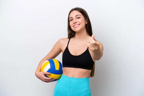 Young caucasian woman playing volleyball isolated on white background making money gesture