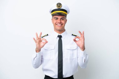 Airplane pilot caucasian man isolated on white background showing an ok sign with fingers