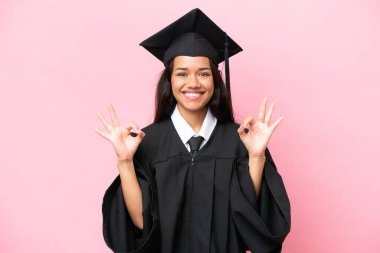 Young university Colombian woman graduate isolated on pink background in zen pose
