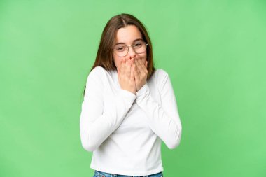 Teenager girl over isolated chroma key background happy and smiling covering mouth with hands