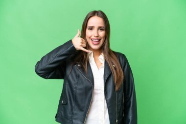 Young beautiful woman over isolated chroma key background making phone gesture. Call me back sign