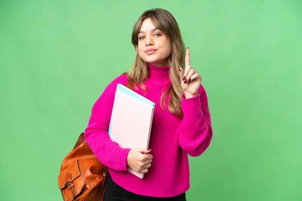 Young Student Girl Isolated Chroma Key Background Showing Lifting Finger — Stock Photo, Image