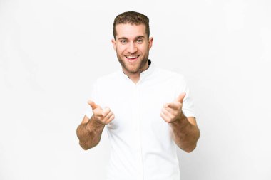 Young handsome blonde man over isolated white background pointing to the front and smiling clipart