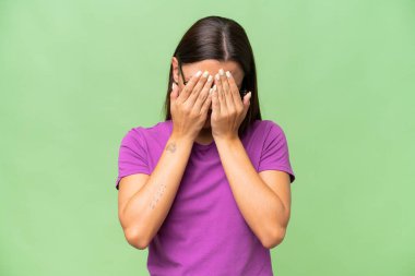 Young caucasian woman isolated on green chroma background with tired and sick expression