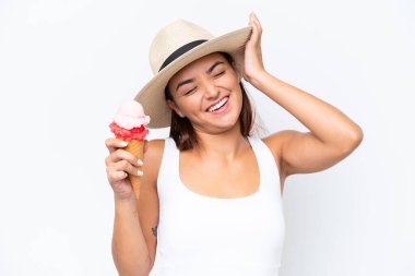 Young caucasian woman with a cornet ice cream isolated on white background has realized something and intending the solution