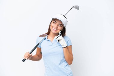 Young caucasian woman playing golf isolated on white background thinking an idea while looking up