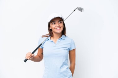 Young caucasian woman playing golf isolated on white background thinking an idea while looking up