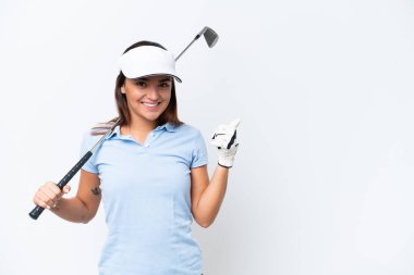 Young caucasian woman playing golf isolated on white background pointing to the side to present a product