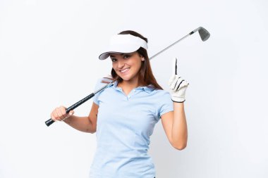 Young caucasian woman playing golf isolated on white background showing and lifting a finger in sign of the best