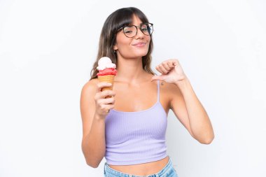 Young caucasian woman with a cornet ice cream over isolated white background proud and self-satisfied