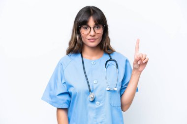 Young caucasian nurse woman isolated on white background showing and lifting a finger in sign of the best