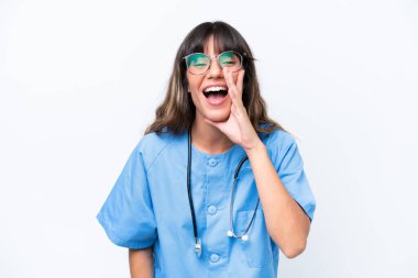Young caucasian nurse woman isolated on white background shouting with mouth wide open
