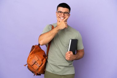 Handsome student man over isolated background happy and smiling